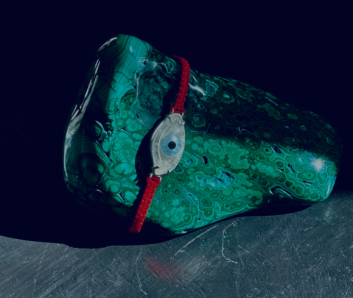 Carved crystal evil eye for protection. Evil Eye jewelry.